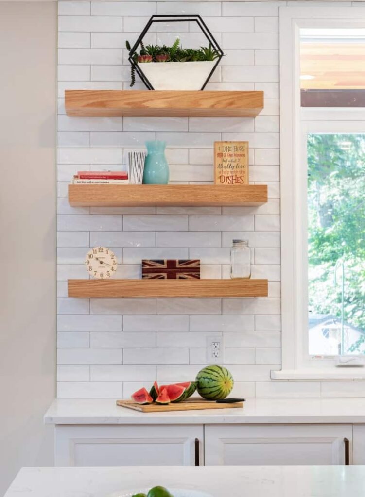 3 open shelves in a beautiful white kitchen